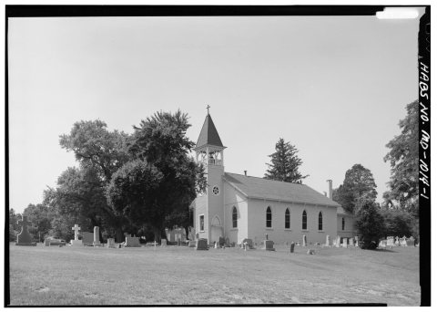 GENERAL PERSPECTIVE VIEW OF EAST (FRONT) AND NORTH SIDE, LOOKING SOUTHWEST WITH CEMETERY IN FOREGROUND - Sacred Heart C…