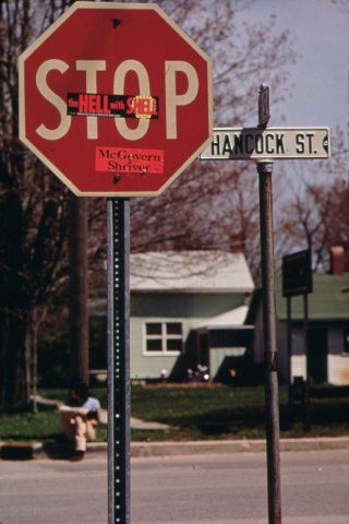 STICKER ON STOP SIGN READS, "THE HELL WITH SHELL"-IN