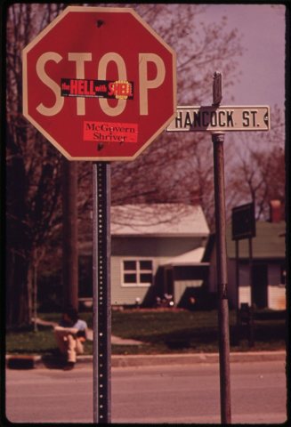 STICKER ON STOP SIGN READS, "THE HELL WITH SHELL"-IN