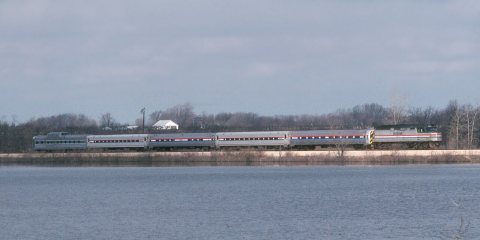 Amtrak train crossing Lake Topinabee, March 1990