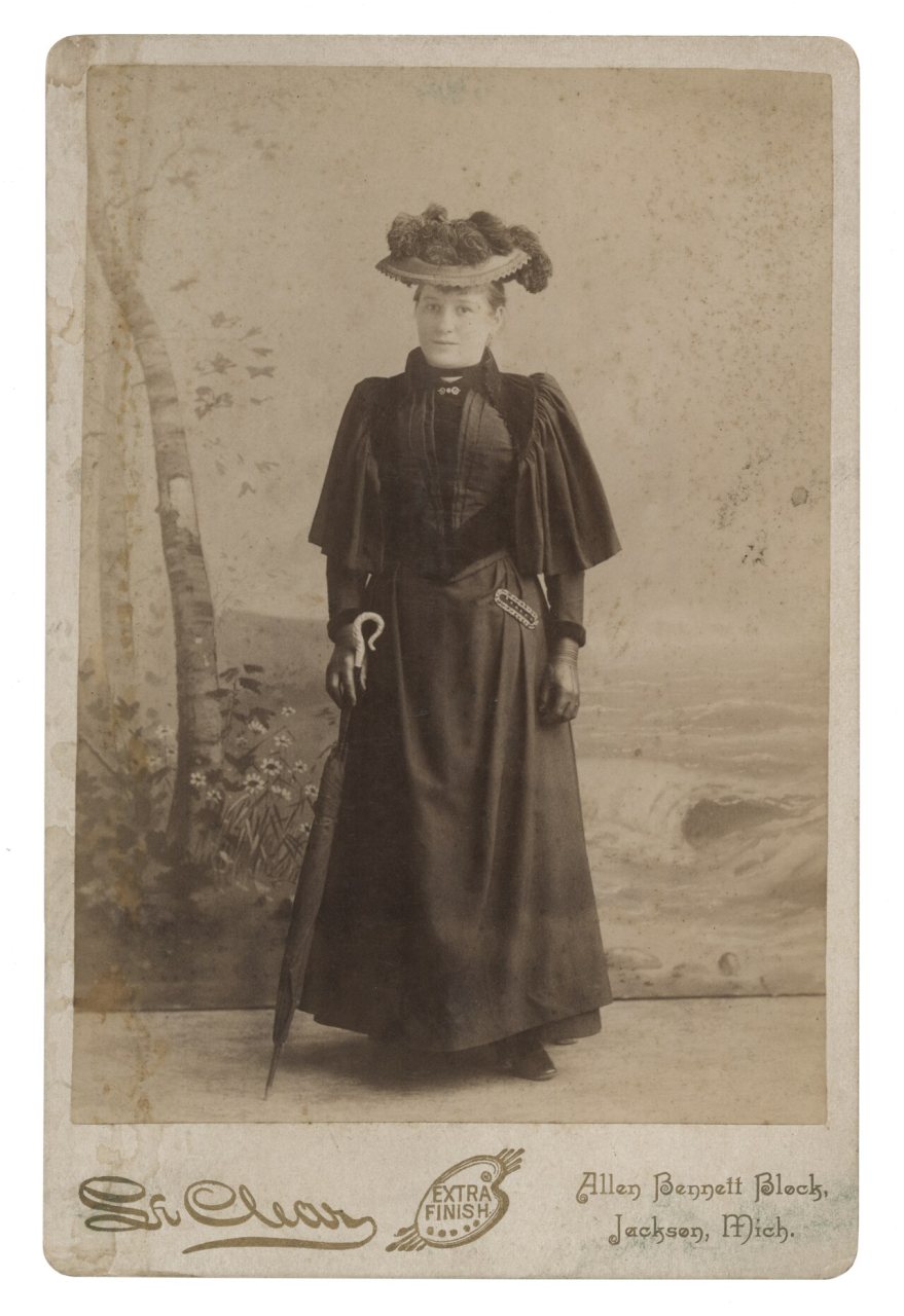 Portrait of an unidentified woman holding a parasol