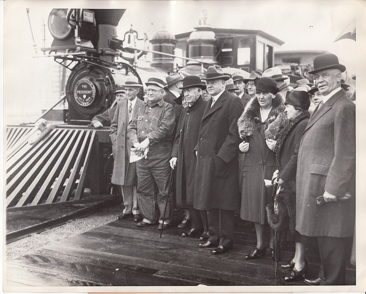 Henry Ford, President Herbert Hoover, and Thomas Edison arriving with their spouses in Dearborn, Michigan for Light's G…