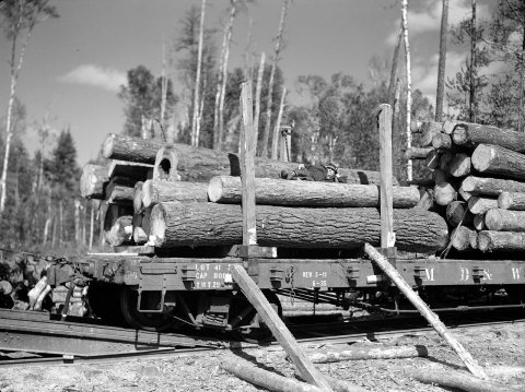 Partially-loaded car of lumber
