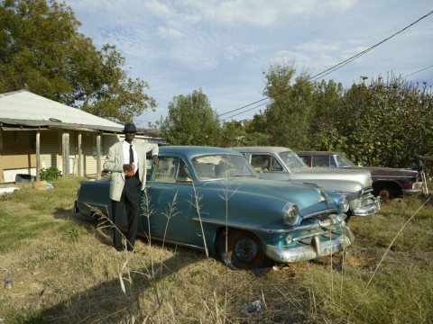 Andrew Ben Williams enjoys a soda after church in tiny Glendora, Mississippi