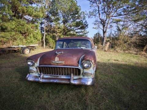 Classic, if well-worn, 1955 Chevrolet in a field near Taylor, Mississippi
