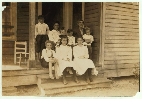 Kuyrkendall family, recently from farm. Three children in front row (one ten and one twelve) and one boy not here, work…