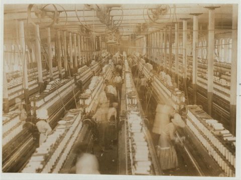 Interior of Magnolia (Miss.) Cotton Mills spinning room. See the little ones scattered through the mill. All work. See …