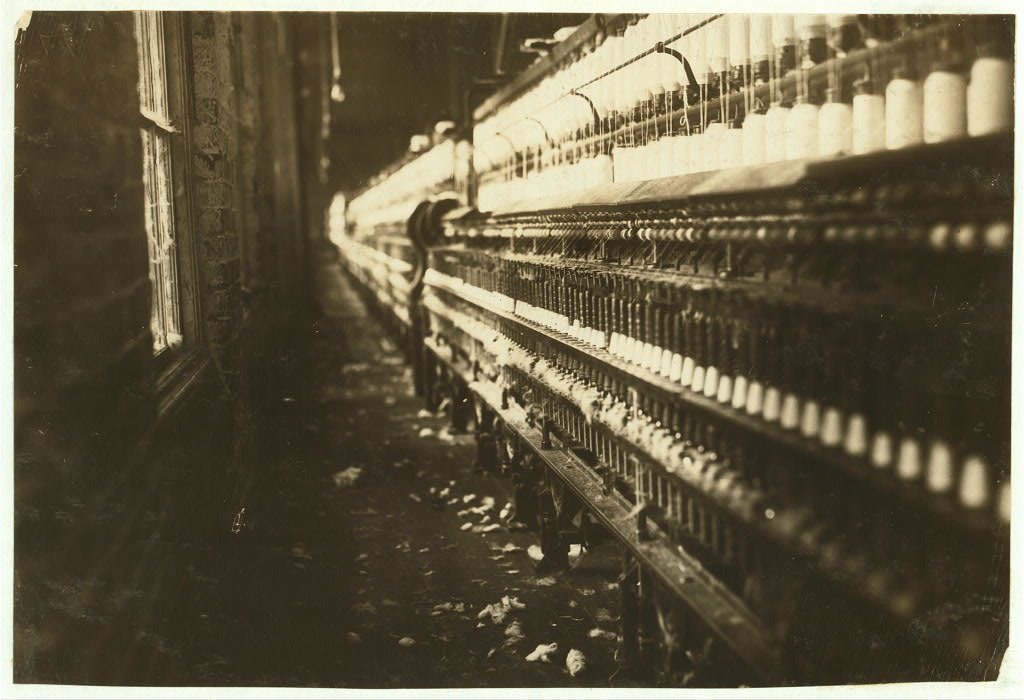 View of spinning frames which were tended by some very young workers apparently eight to ten. The superintendent refuse…