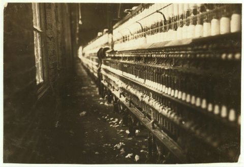 View of spinning frames which were tended by some very young workers apparently eight to ten. The superintendent refuse…