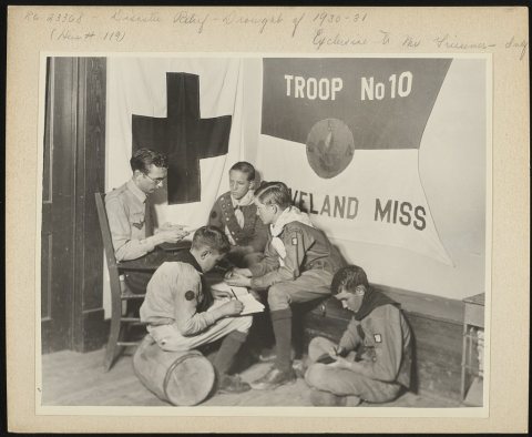 Boy Scouts and their scoutmaster were valuable workers for the Red Cross in the drought relief work around Cleveland, M…