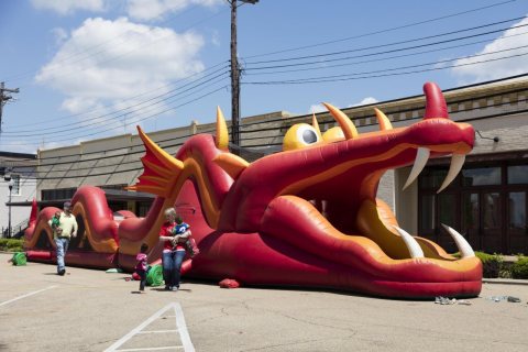 A friendly blow-up dragon at a town fair