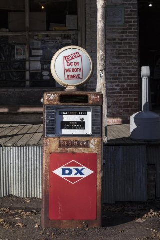 Sign atop an old gas pump