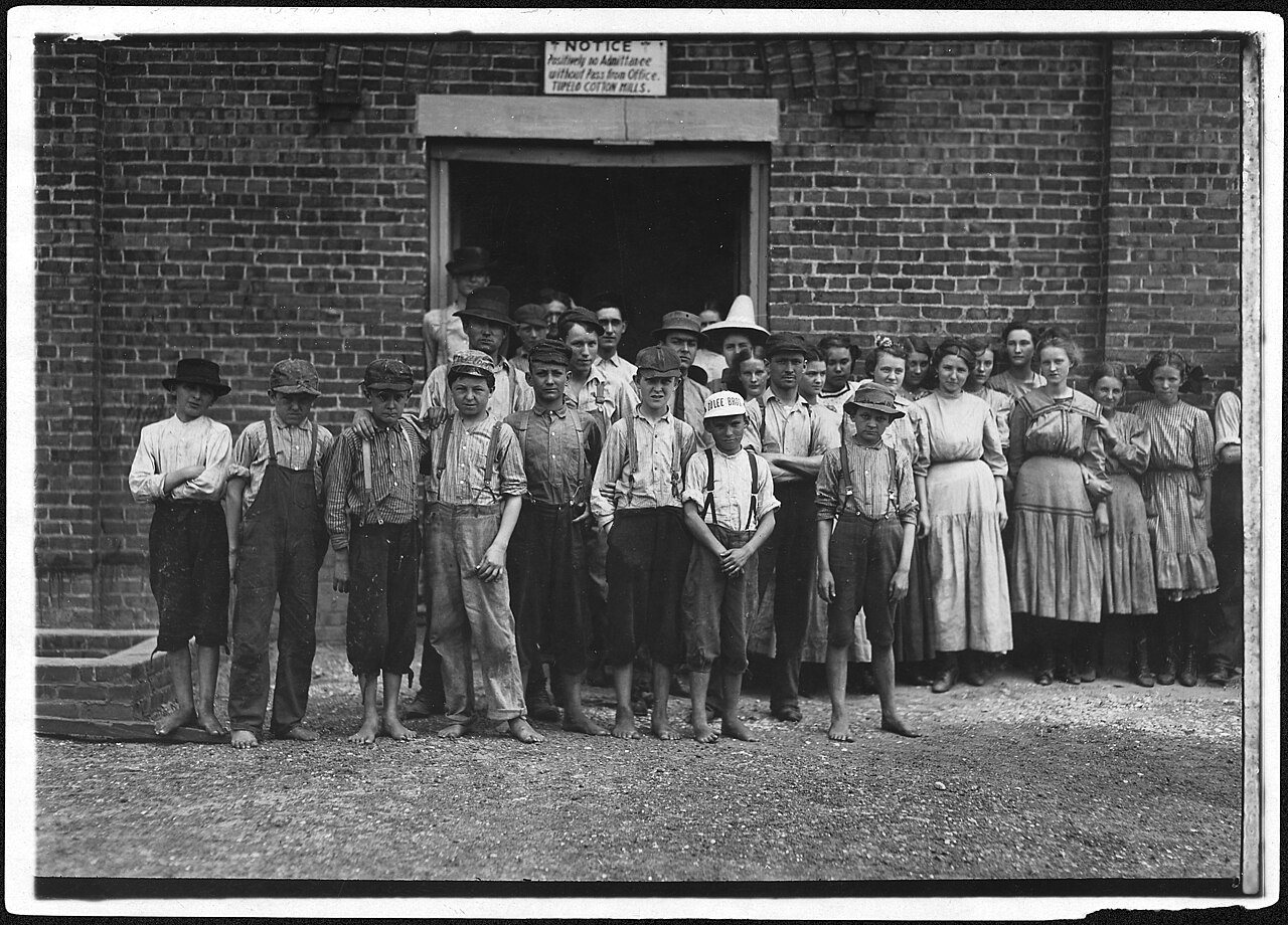 Part of the force at Tupelo Cotton Mills. All work. Smallest ones not in photo. Among youngest here are, Coleman... - N…