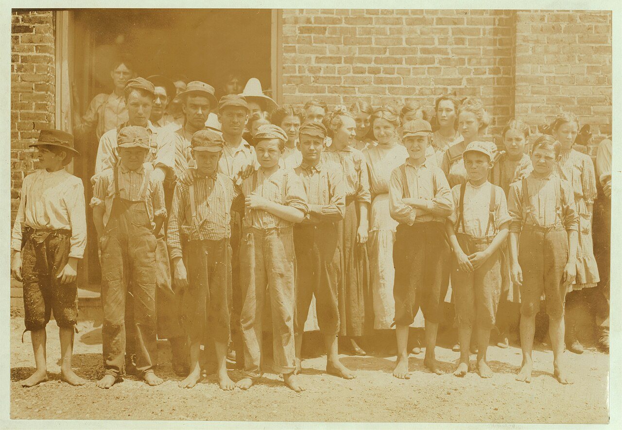 Part of the force at Tupelo (Miss.) Cotton Mills. All work. Smallest ones not in photo. Among youngest here are- Colema…