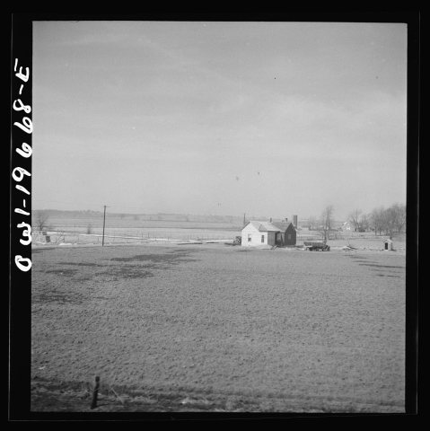 Untitled photo, possibly related to: Camden (vicinity), Missouri. A farmstead along the right of way on the Atchison, T…