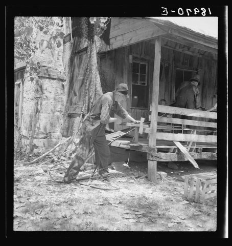 In Arkansas Hills (Ozarks) near Seligman, Missouri, splitting hickory for chair-bottoms. His father before him and his …